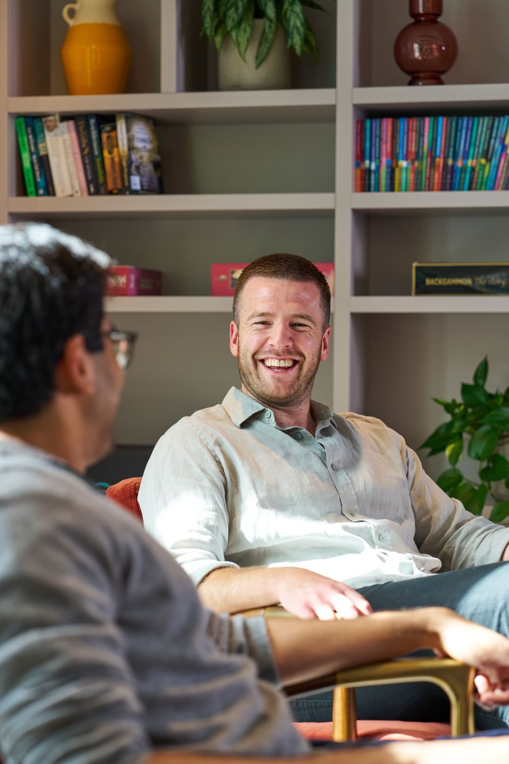 Staff members chatting in a breakout area.