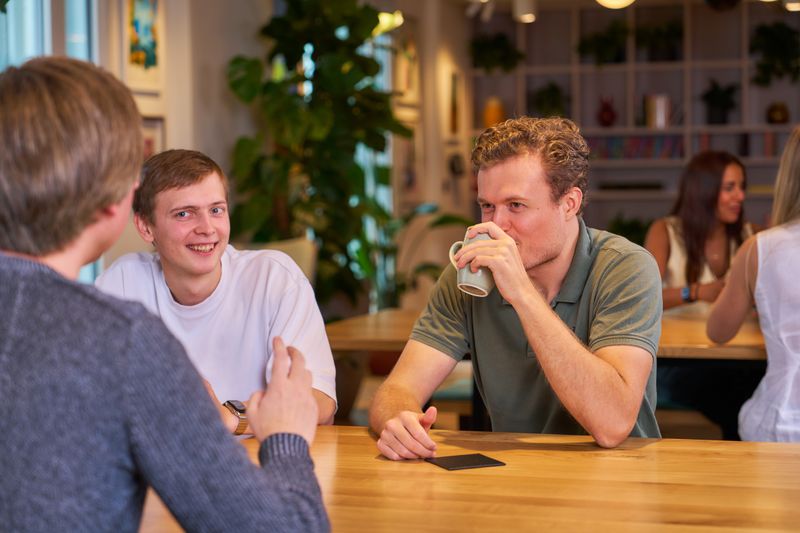 Staff members catching up in the café.